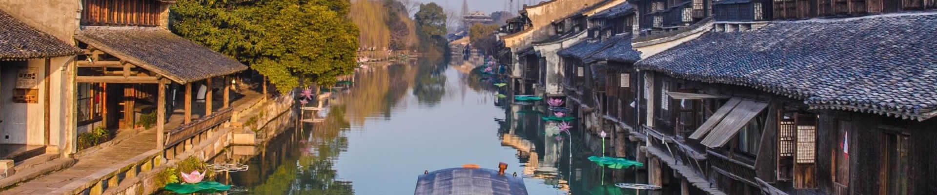 With a history of over 6,000 years, Wuzhen ancient town features old houses lining up along the river and flagstone lanes as well as flowing water and stone bridges.